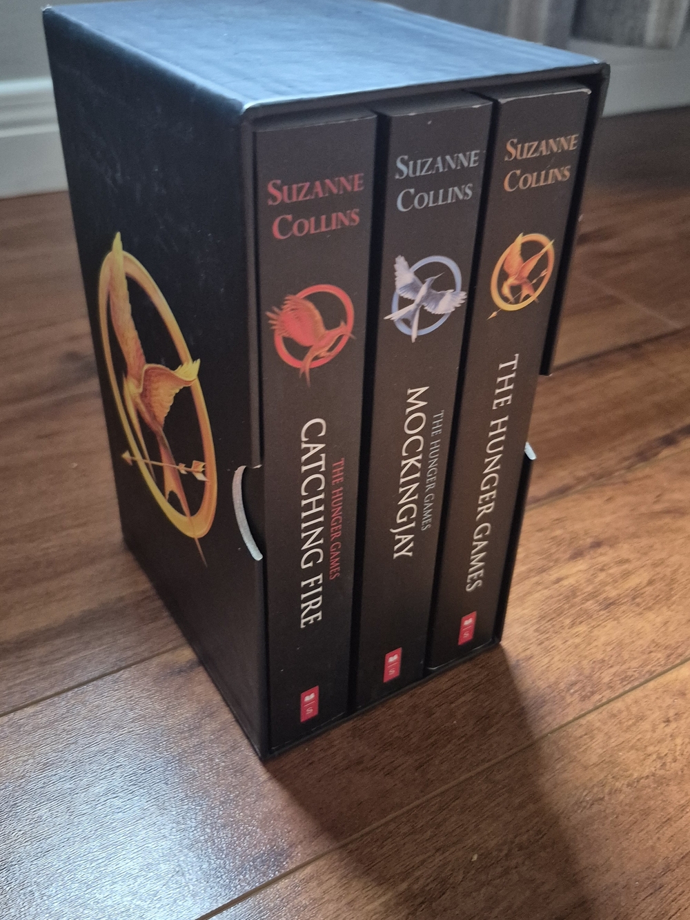 The Hunger Games Trilogy Box Set by Suzanne Collins - Black with Gold Accents